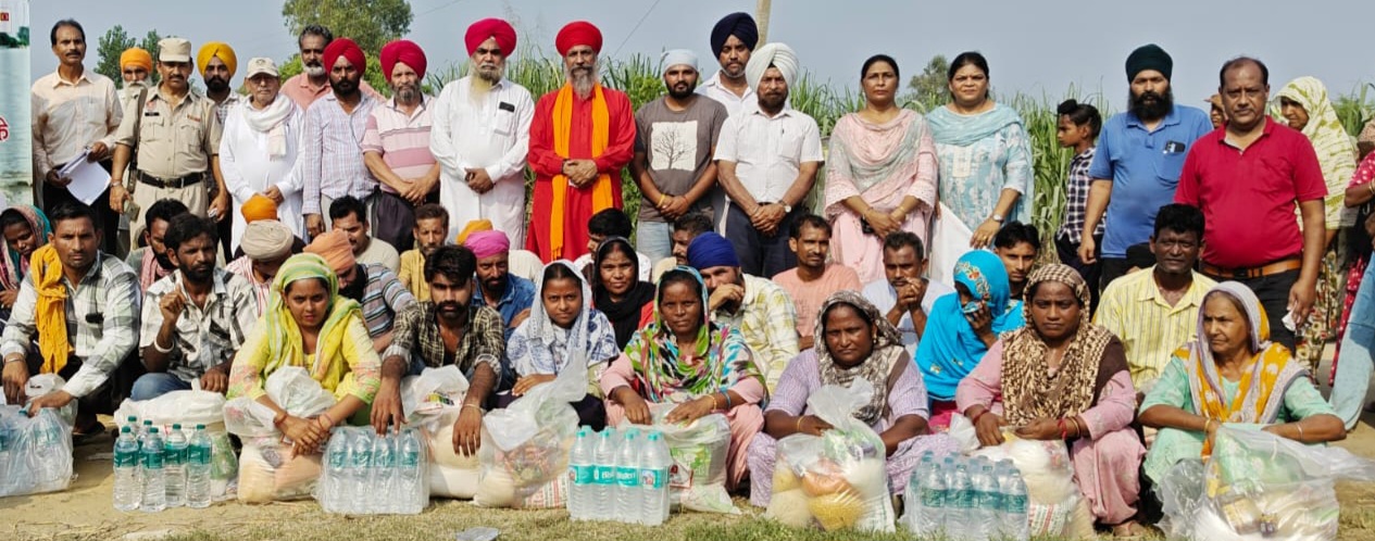 Sant Satwinder Hira of All India Adi Dharam Mission distributed relief materials to flood victims;